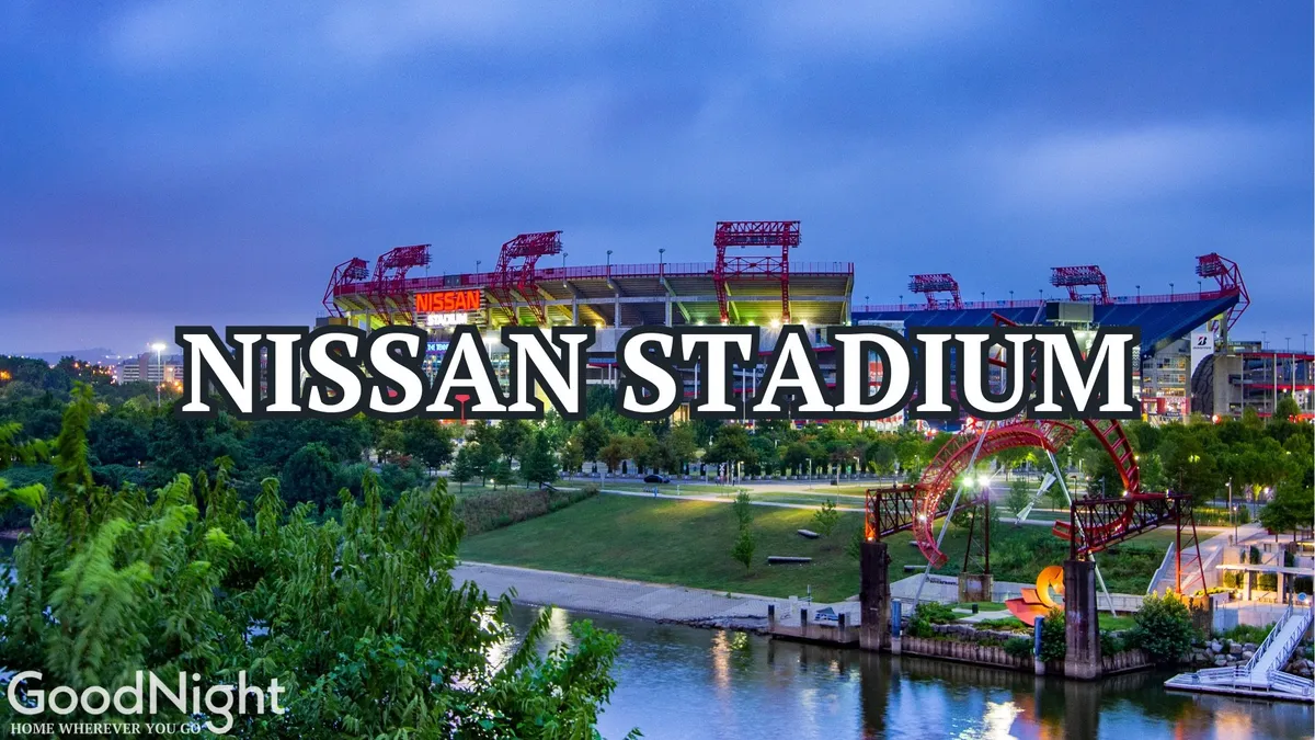 Nissan Stadium stands prominently in the background, surrounded by a green park and set beside the river, hinting at its vibrant event atmosphere. The scene buzzes with anticipation for sports events or outdoor concerts, perfectly encapsulating the energy of local gatherings.