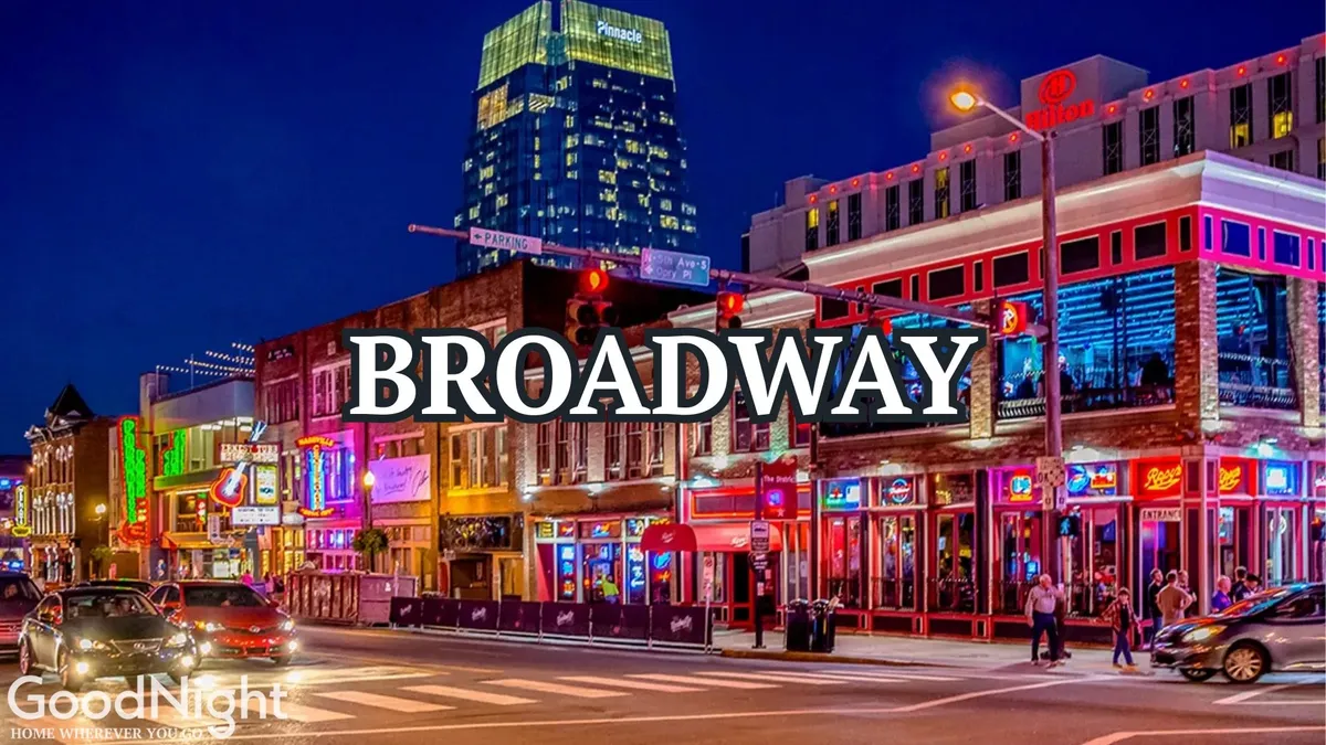 A vibrant nighttime streetscape featuring neon signs, a bustling busy street, crowds of people walking, and restaurants and bars lining the scene. The energy of nightlife is palpable, with groups gathering to enjoy live music and social activities.